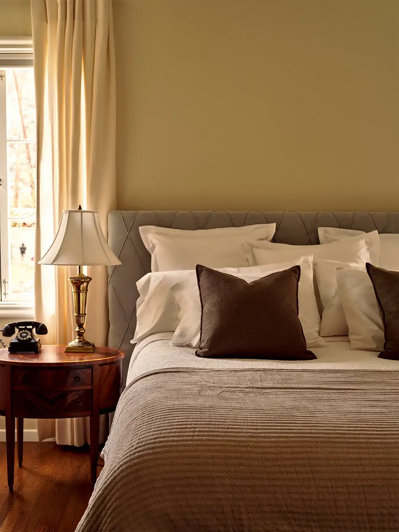 Fountain bed with side table under window
