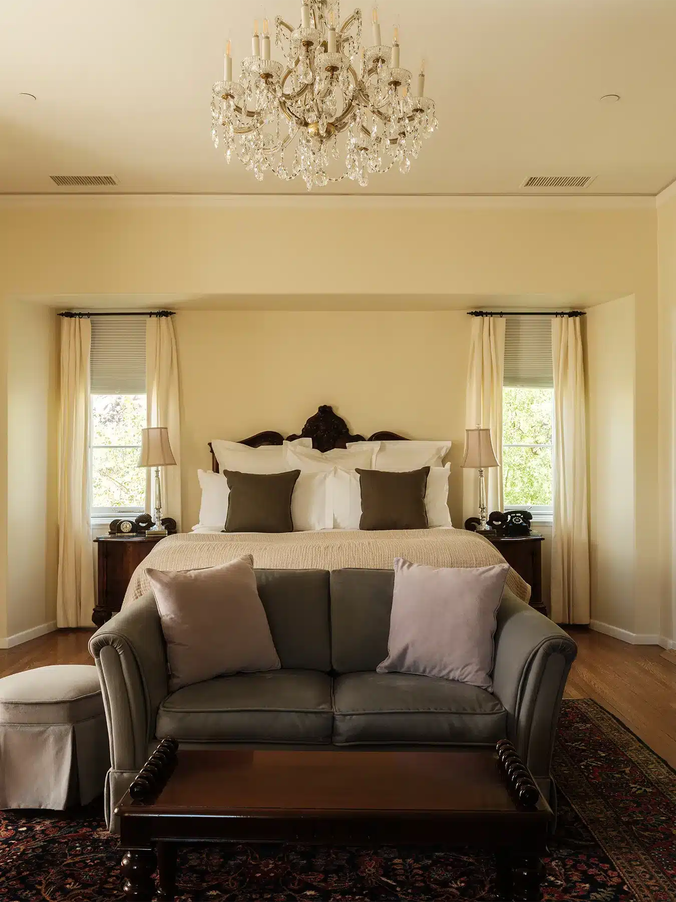 Rose bed with side tables and bench at foot