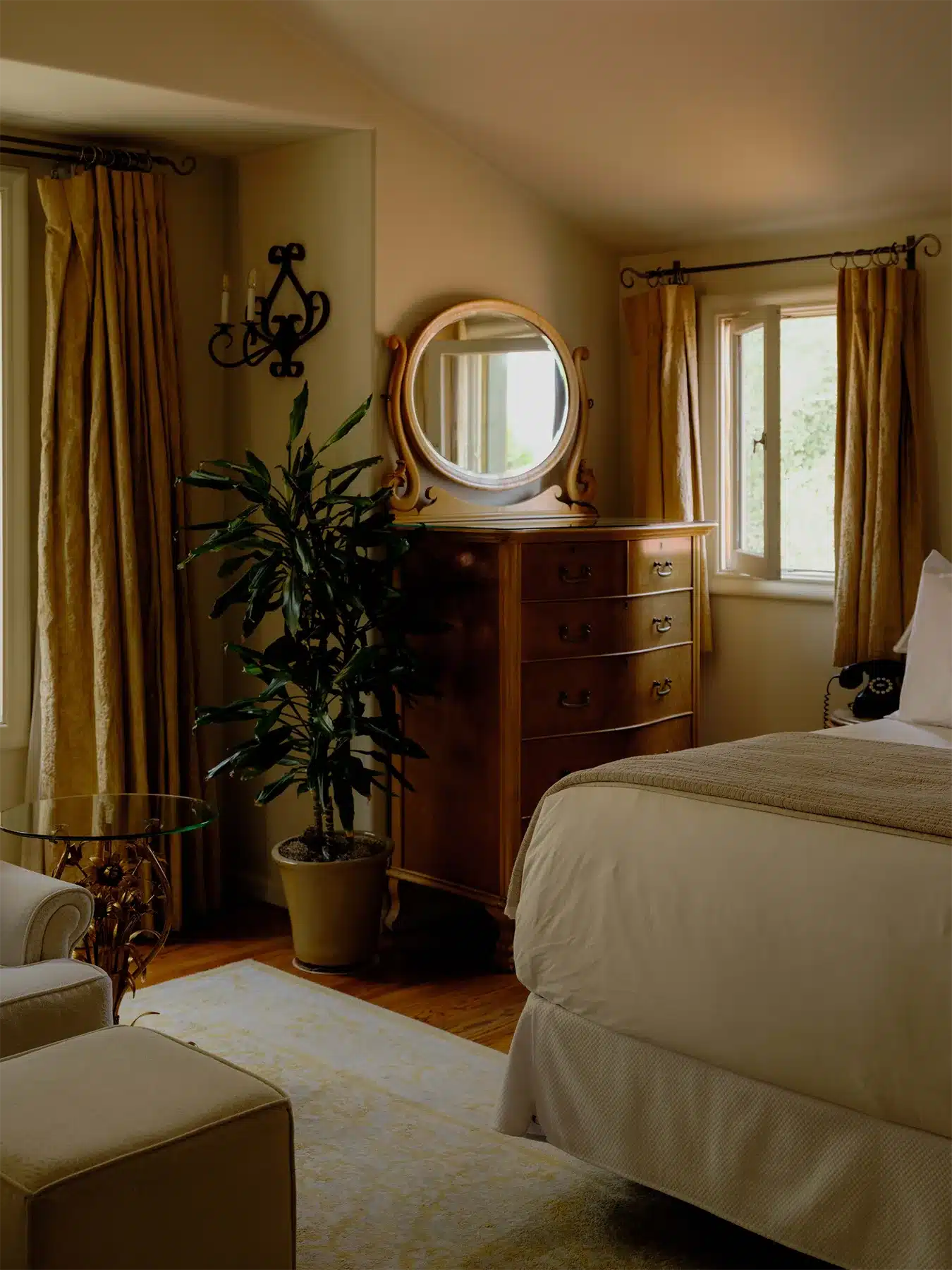 Waterfall dresser next to bed