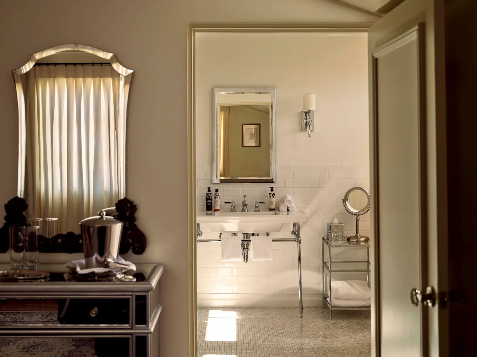 Cielito open door leading to bathroom showing the sink and mirror