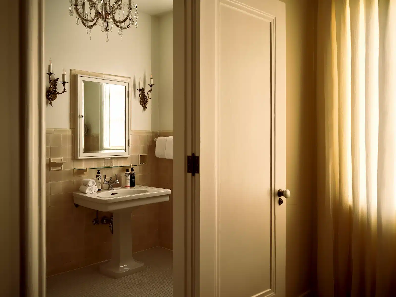Fountain bathroom sink with door leading to room
