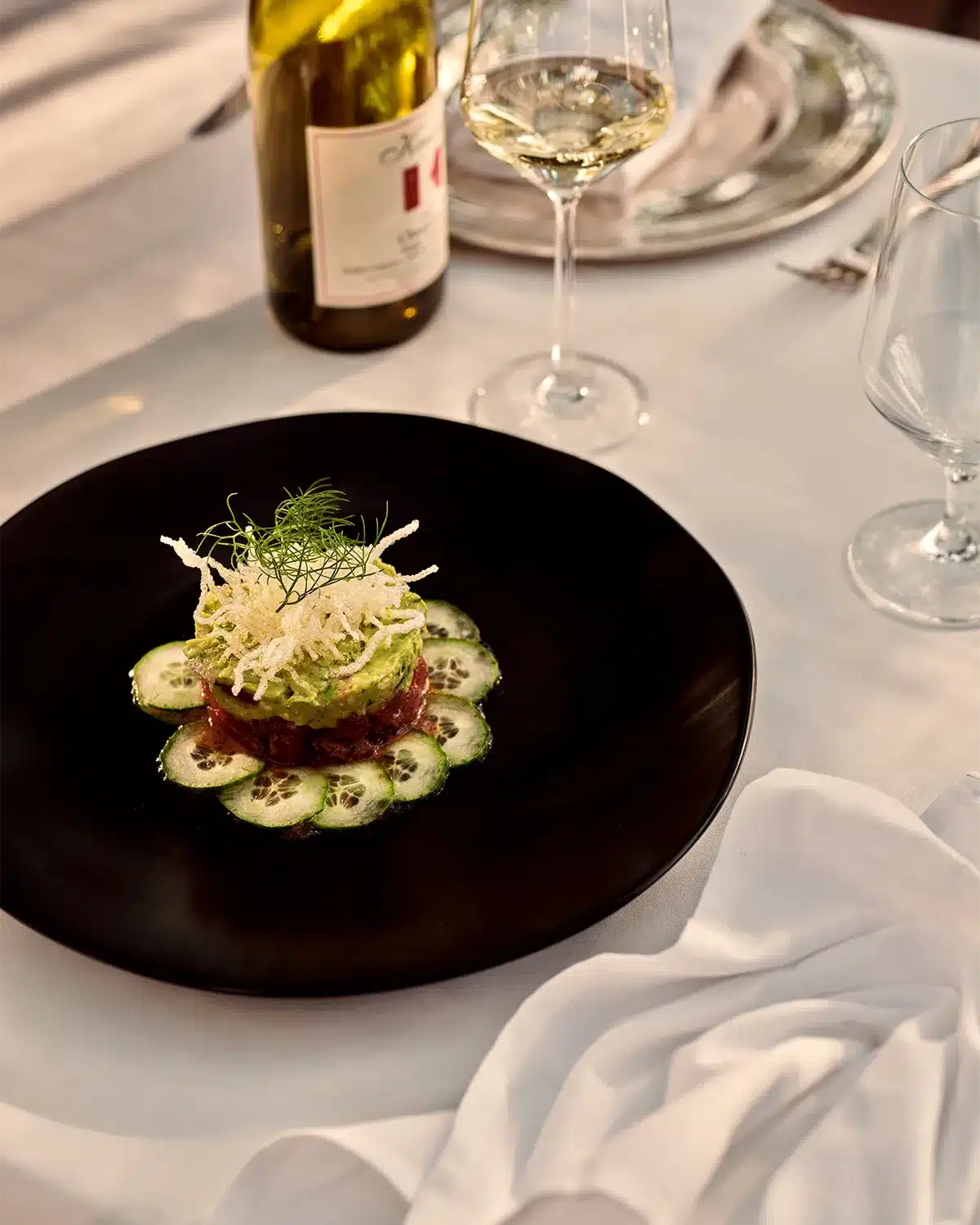 Upscale dinner plate with wine on dining table